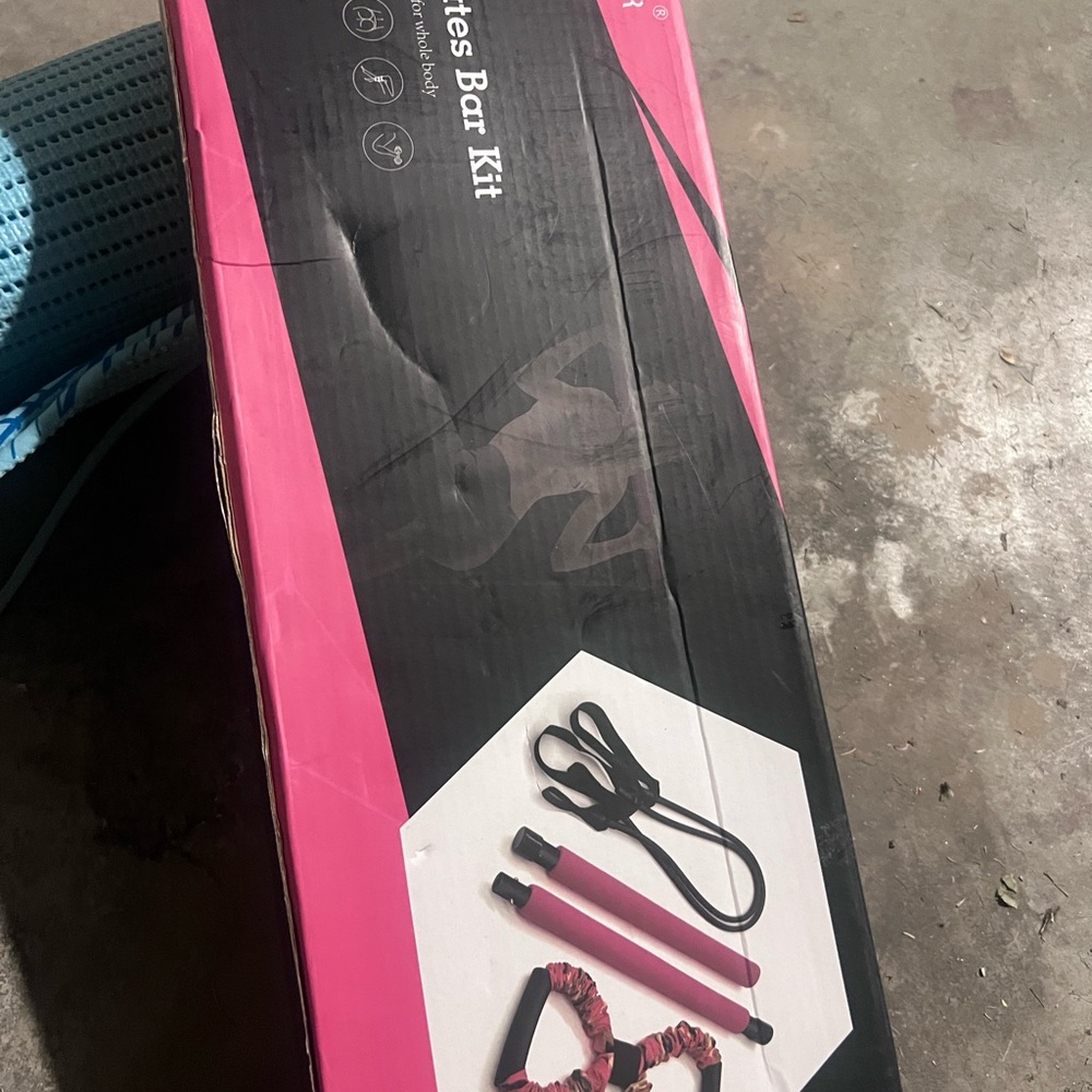 Pink and Black Pilates Bar Kit and yoga mat